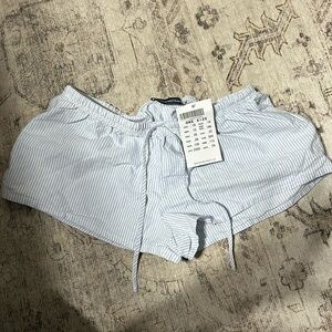 Brandy melville blue and white striped shorts. One size. New with tags..